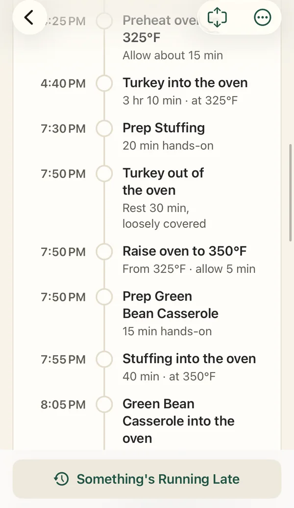 The app's timeline: turkey out of the oven, raise oven to 350°F, stuffing into the oven
